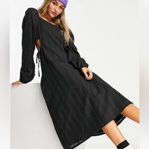 Midi dress with cut out details on the sides